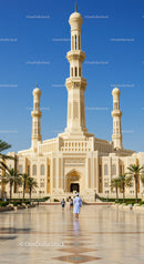 White Minaret Mosque with Tall Spires in Sunny Desert Setting