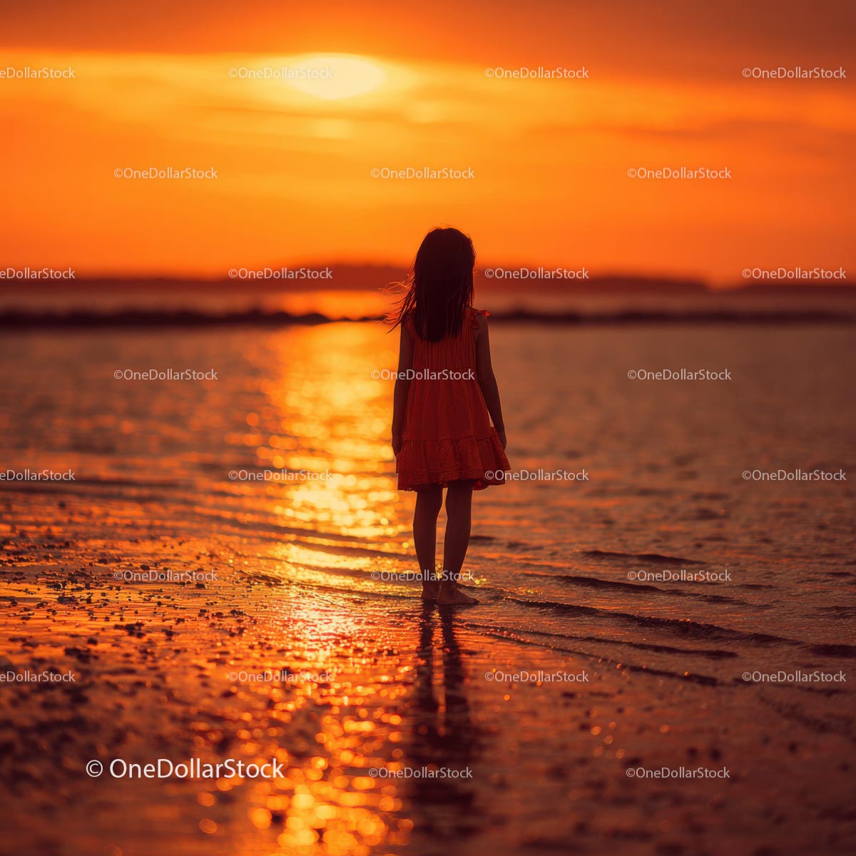 Silhouette of a Child at Sunset by the Ocean Shore
