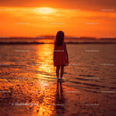 Silhouette of a Child at Sunset by the Ocean Shore