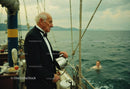 Elderly Man in Tuxedo on a Yacht Sailing Ocean Scene