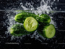 Fresh Cucumber Slices Splashing Water in a Dynamic Close-Up