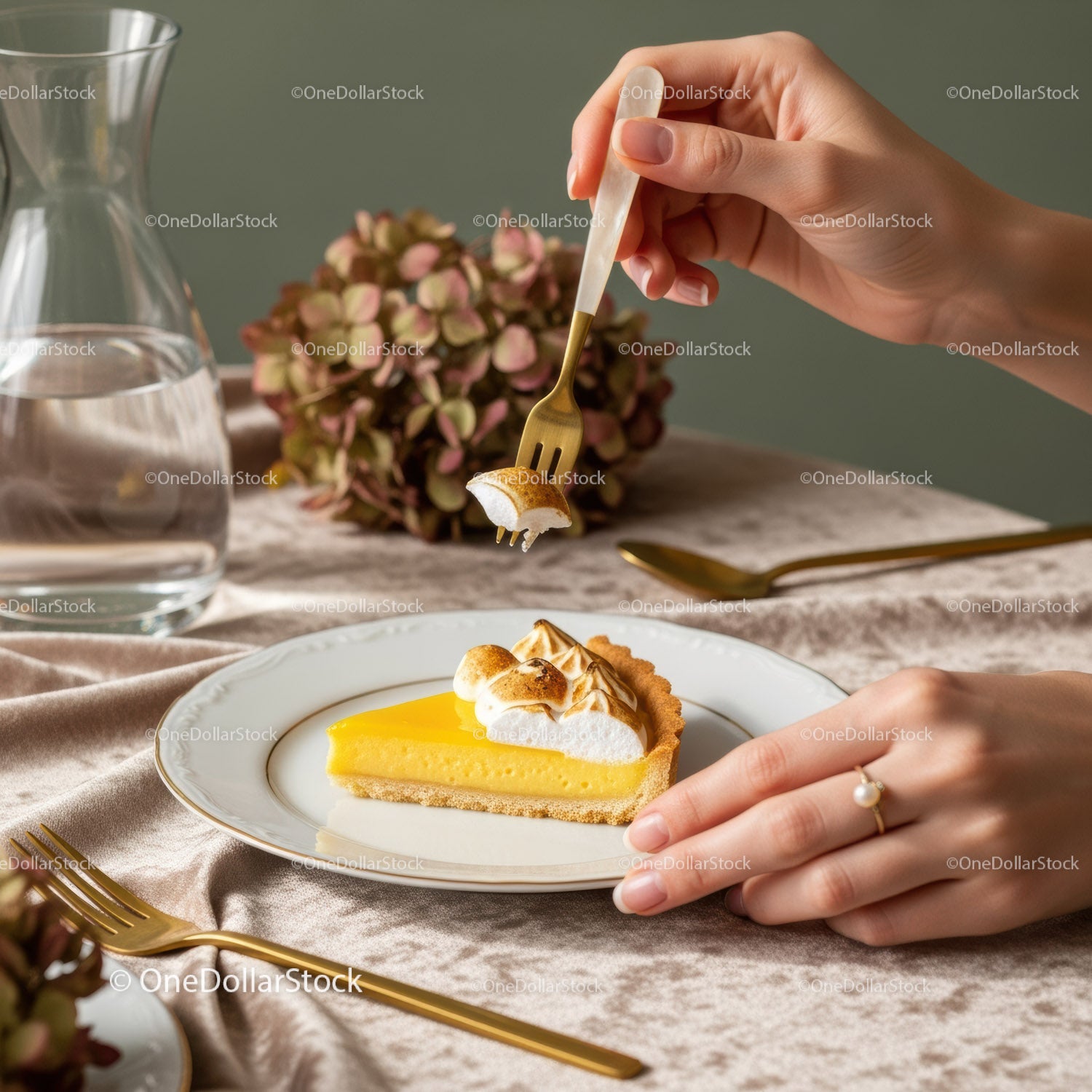 Lemon Tart with Meringue on Elegant Table with Floral Decor