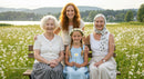 Four Generations of Women Joyfully Together in a Flower Field