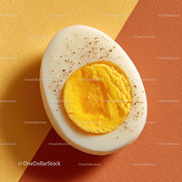 Close-up of Hard Boiled Egg with Yellow Yolk on Colorful Background