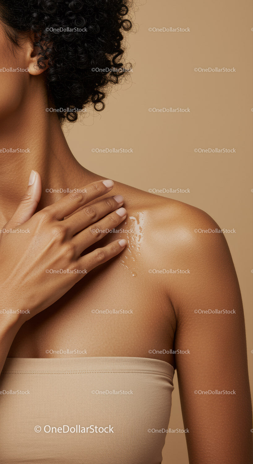 Close-up of Woman's Shoulder and Neck with Radiant Skin in Beige Tones