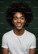 Portrait of a Smiling Young Woman with Curly Hair in Casual White Shirt