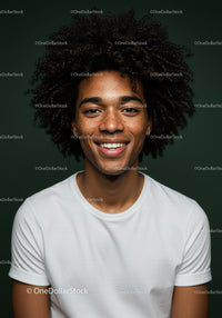 Portrait of a Smiling Young Woman with Curly Hair in Casual White Shirt