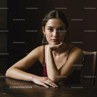 Elegant Woman with Confident Expression in Modern Indoor Setting