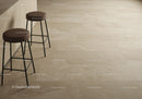 Stylish Bar Stools with Brown Cushions on Elegant Beige Tile Floor