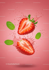 Fresh Strawberry Halves Splashing in Water with Mint Leaves