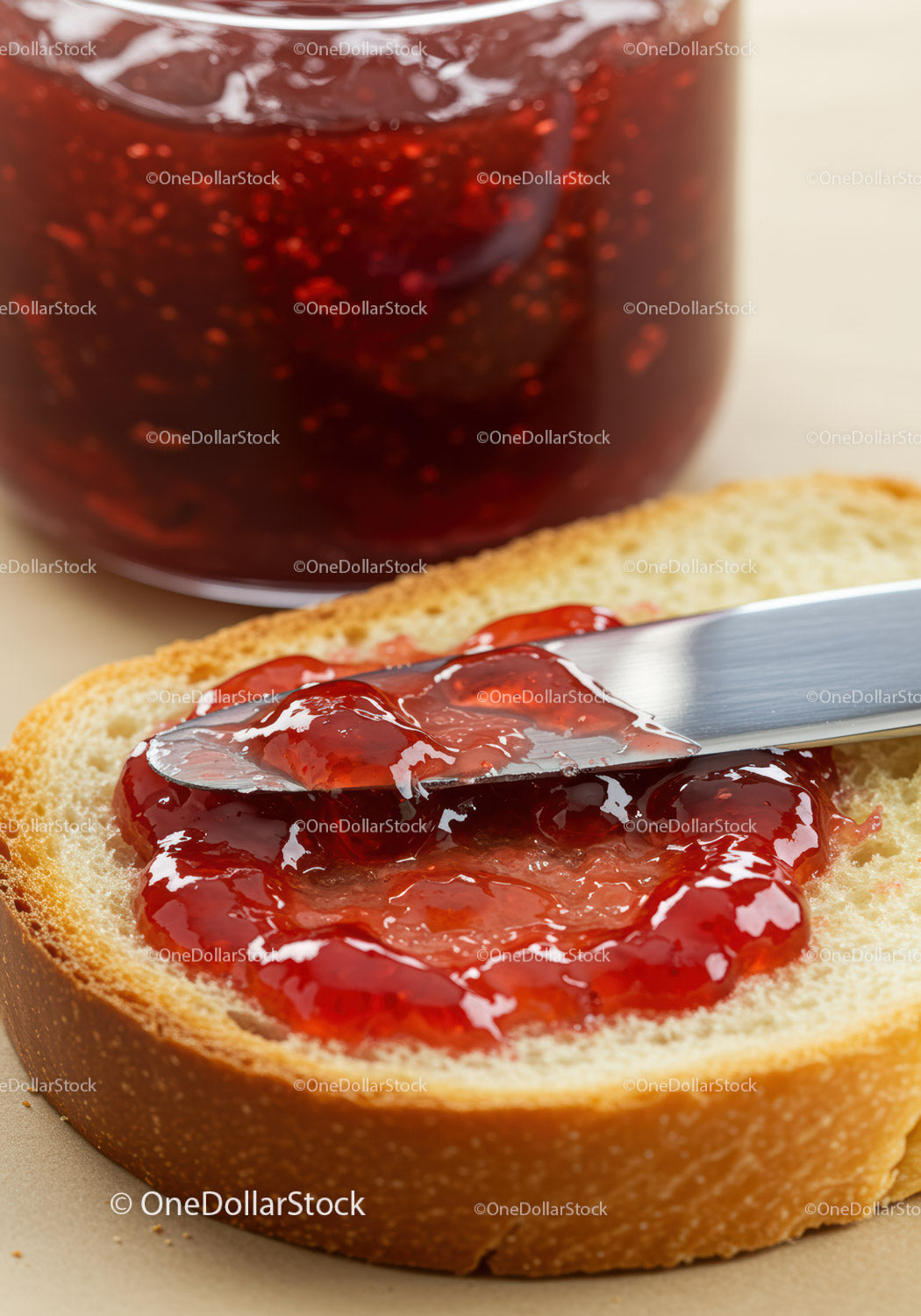 Red Strawberry Jam Spread on Fresh Bread Slice
