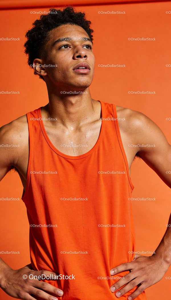 Young athlete catching breath after intense workout
