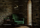Cozy green armchair in rustic stone wall room