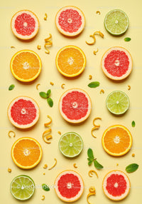Fresh Citrus Fruit Slices Arranged on Yellow Background