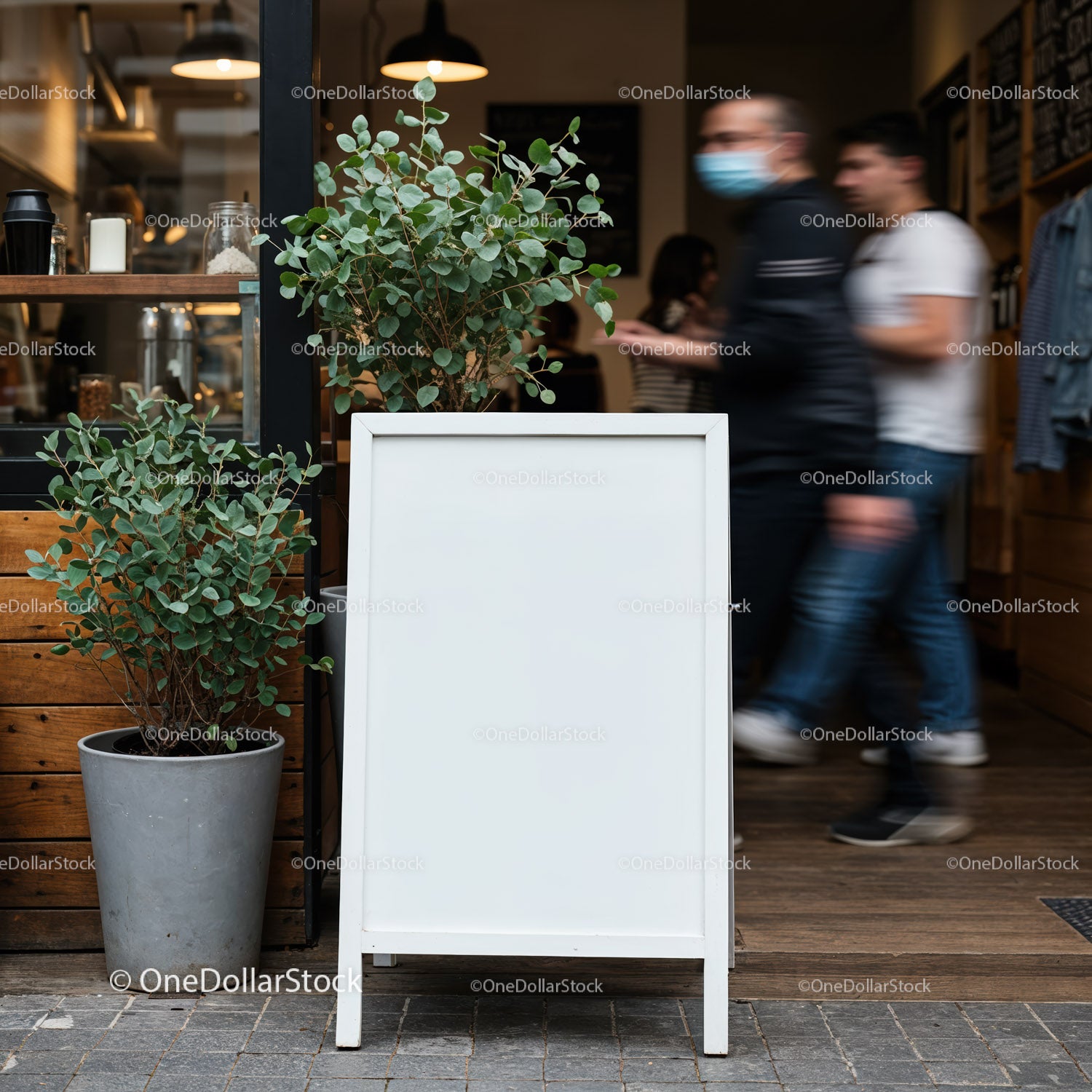 Blank white sidewalk sign outside busy cafe entrance