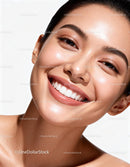 Close-up of smiling woman with glowing natural skin