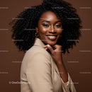 Elegant African American Woman with Curly Hair in Stylish Beige Blazer