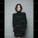 Elegant Woman in Black Suit with Turtleneck and High-Waisted Skirt