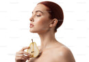 Elegant Woman with Red Hair Holding Pear in Minimalist Beauty Portrait
