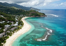 Beautiful Tropical Beach with Lush Green Hills and Clear Blue Water