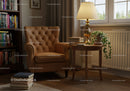 Cozy reading corner with leather armchair and warm lamp