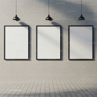 Three Blank Frames on Concrete Wall with Hanging Lamps