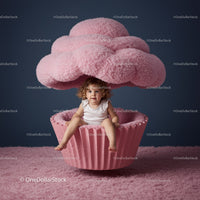 Toddler Sitting Inside Plush Pink Cupcake Prop