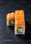 Fresh salmon sushi rolls with avocado and cream cheese