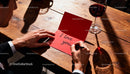 Man Writing Love Message on Red Card with Wine Glass