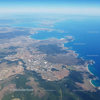 Aerial View of Coastal Landscape with Sandy Beaches and Green Forest