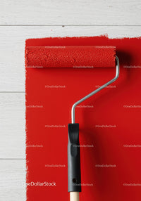 Red Wall Painting With Paint Roller on White Wooden Surface