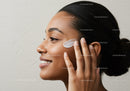 Young Woman Applying Moisturizer for Healthy Skin