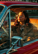 Stylish Woman Driving Vintage Car During Sunset Outdoor Scene