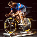 Focused cyclist training intensely on indoor rollers