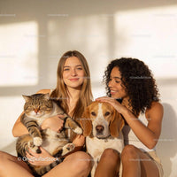 Two Women Enjoying Time with Their Dog and Cat