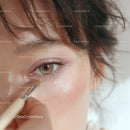 Close-up of Woman Applying Eye Makeup with Brush in Beauty Routine