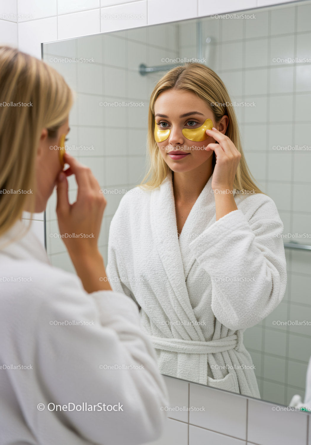 Woman in White Robe Applying Gold Eye Masks in Spa or Bathroom