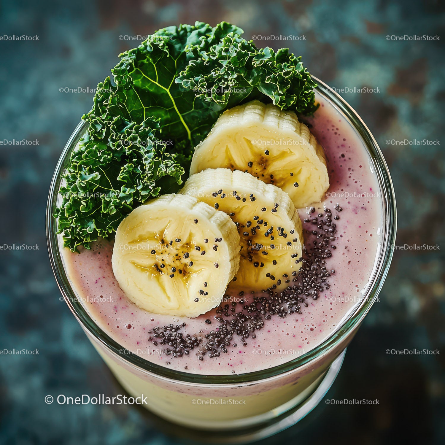 Banana Slices and Kale in Healthy Pink Smoothie with Chia Seeds