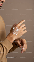 Close-Up of Male Hand Applying Lotion for Moisturizing Skin