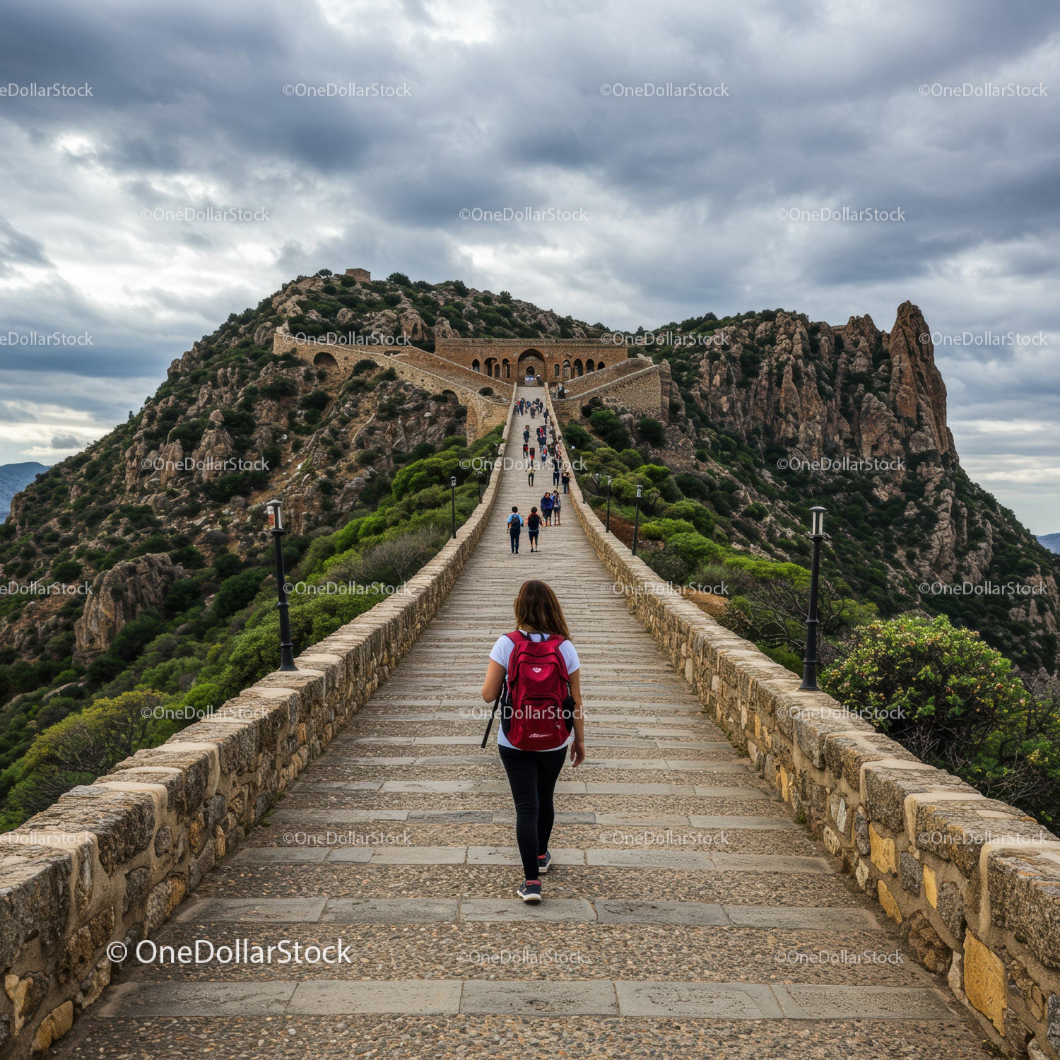 Mountain Hill with Fortress and Stone Staircase Under Cloudy Sky