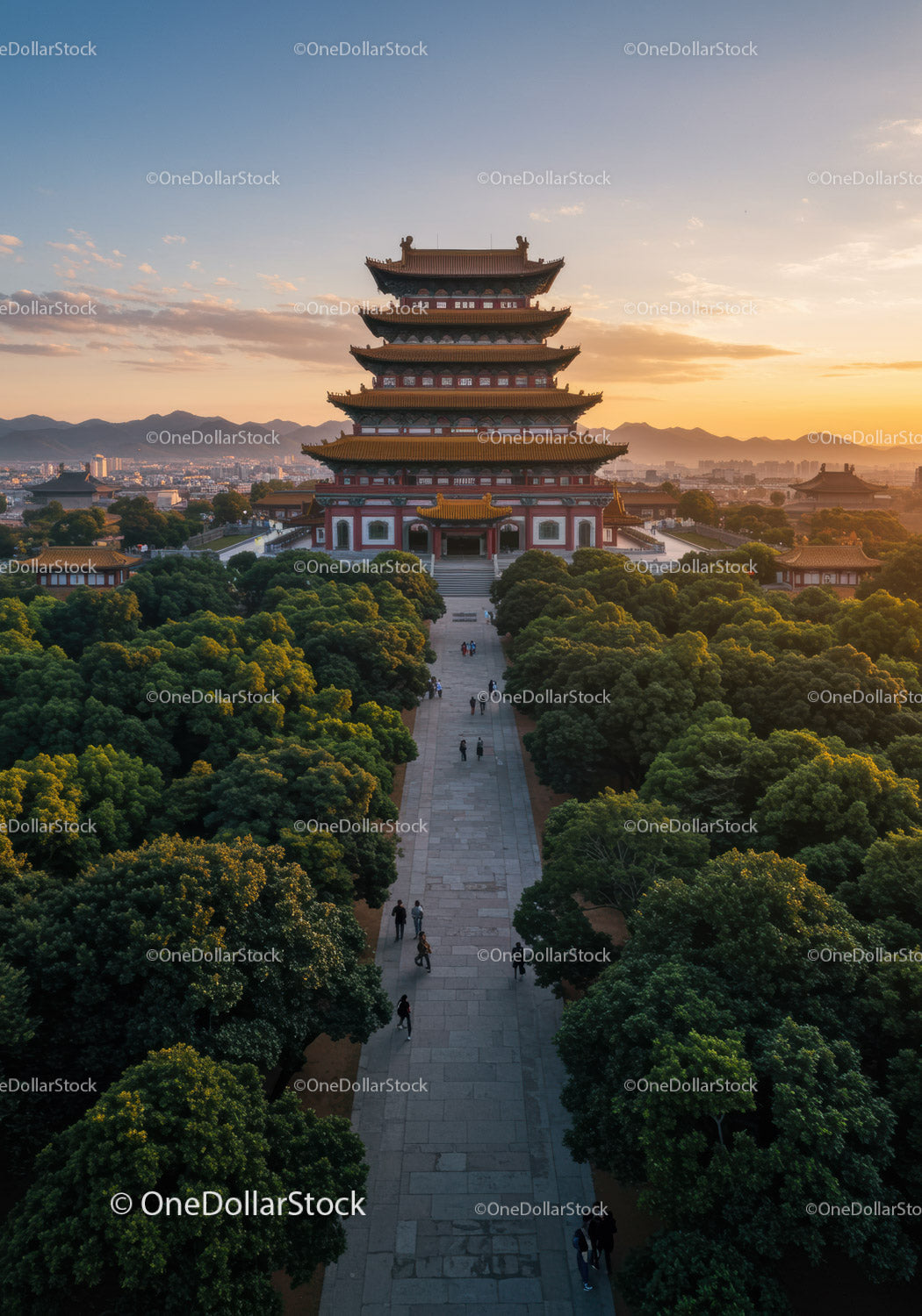 Traditional Pagoda Tower at Sunset Over City and Mountain Landscape