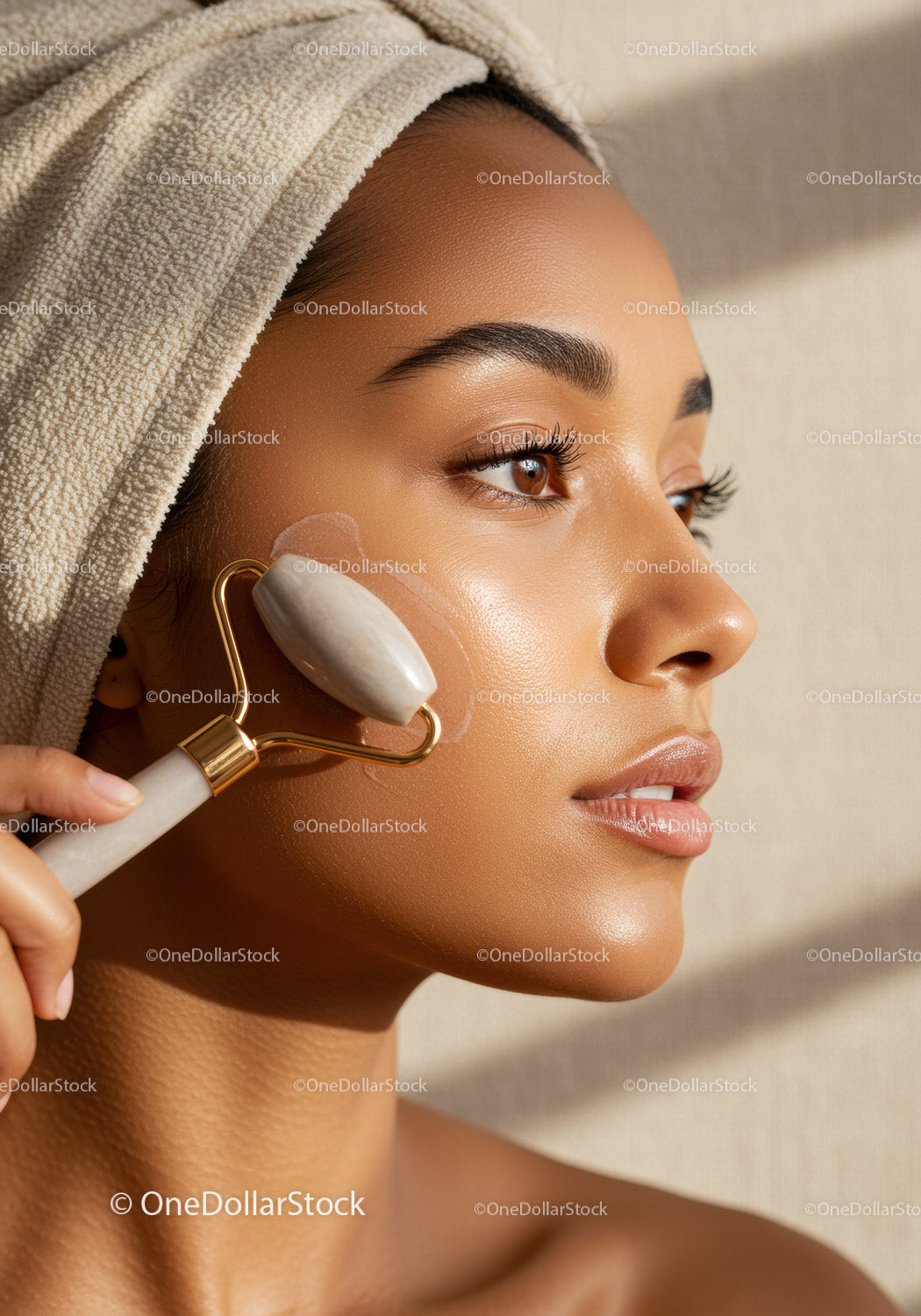 Woman Using Jade Roller for Skincare Facial Massage with Natural Glow