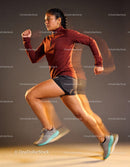 Athletic woman sprinting with focused determination