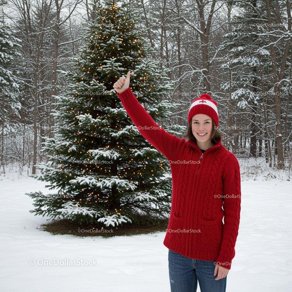 Smiling woman in red sweater thumbs up near decorated tree