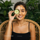 Young Woman Enjoying Cucumber Facial Mask in Spa Setting