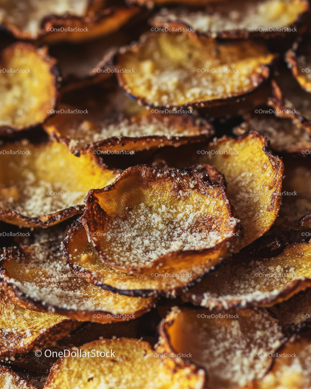 Close-up of Crispy Salted Potato Chips with Golden Brown Edges