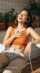 Joyful Woman Relaxing Outdoors with Bright Smile and Casual Style