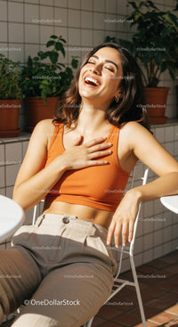 Joyful Woman Relaxing Outdoors with Bright Smile and Casual Style