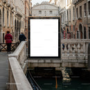 Empty billboard on canal bridge in historic Venice street