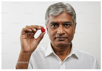 Senior Man Holding Raspberry Close-Up Portrait for Healthy Lifestyle